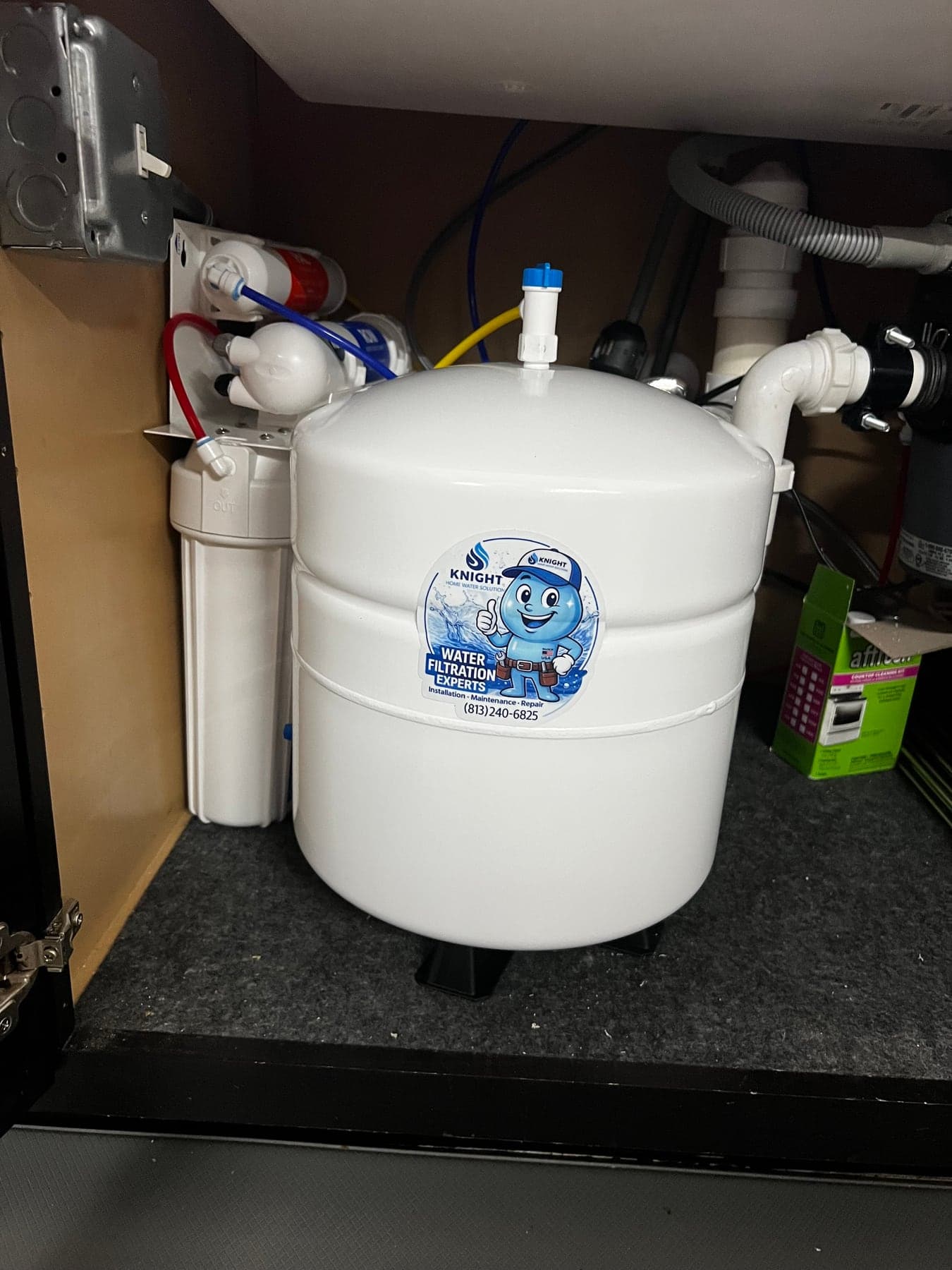 Knight Home Water Solutions reverse osmosis drinking water filter and storage tank under a kitchen sink